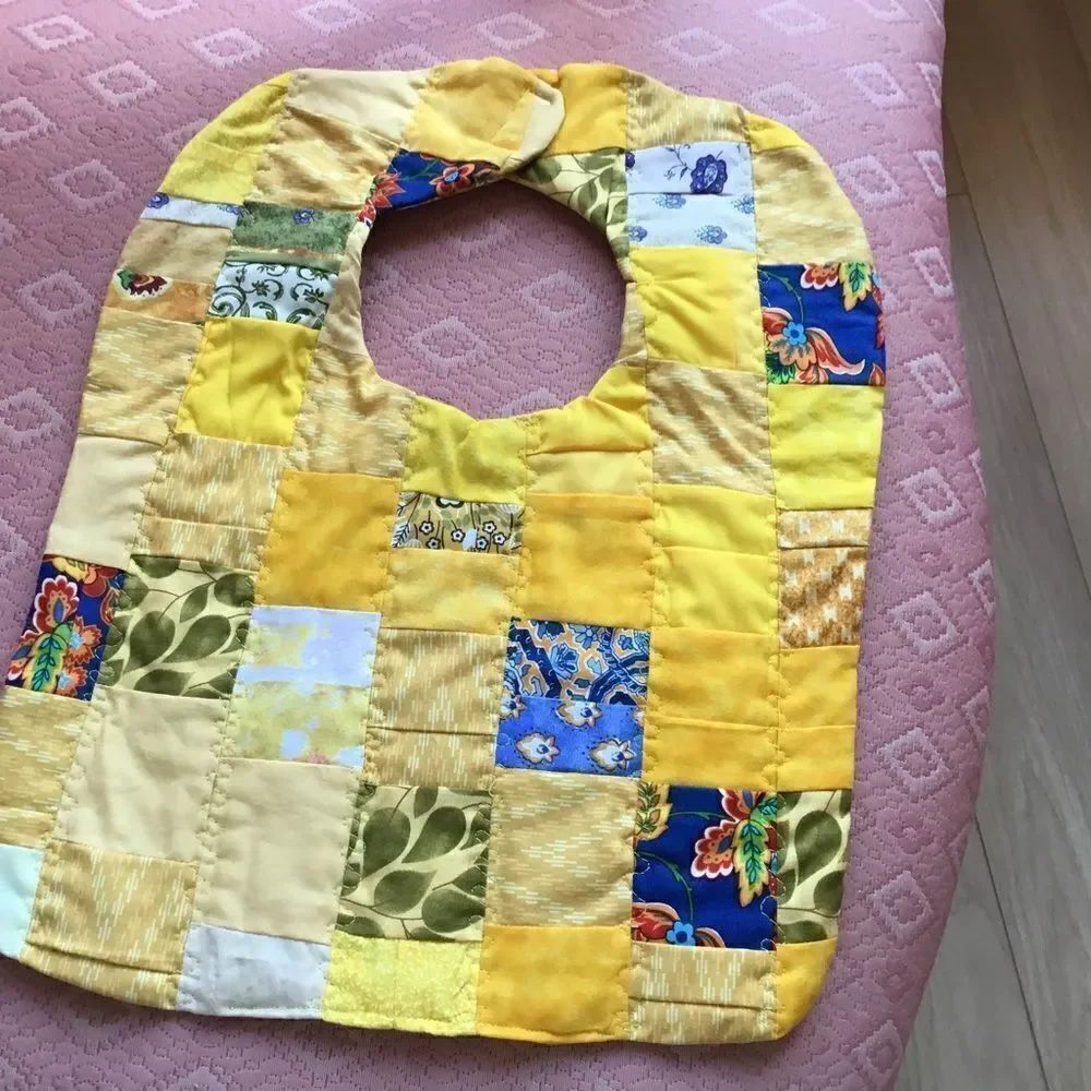 3/$25 or $12 each.  Hand Crafted, Quilted Yellow Reversible Baby Bib
